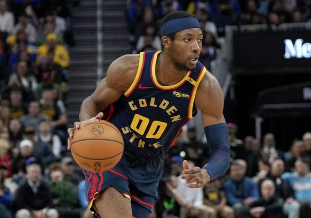 Jonathan Kuminga of the Golden State Warriors dribbles the ball against the Sacramento Kings during the fourth quarter of an NBA basketball game at Chase Center on March 13, 2025, in San Francisco.