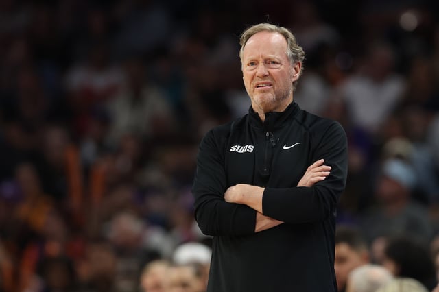 Head coach Mike Budenholzer of the Phoenix Suns reacts during the first half of the NBA game at PHX Arena on April 08, 2025 in Phoenix, Arizona.