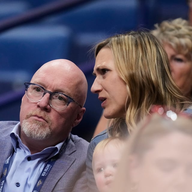 New Orleans Pelicans executive vice president of basketball operations David Griffin watches from the stands with his wife Meredith Hale Griffin in the first half of an NBA basketball game against the Oklahoma City Thunder in New Orleans, Sunday, April 13, 2025. (AP Photo/Gerald Herbert)