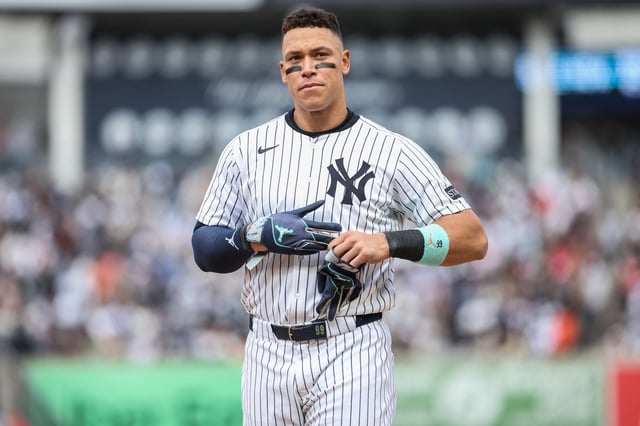 Apr 13, 2025; Bronx, New York, USA;  New York Yankees right fielder Aaron Judge (99) heads back to the field after getting stranded on first base in the seventh inning against the San Francisco Giants at Yankee Stadium. Mandatory Credit: Wendell Cruz-Imagn Images/ File Photo