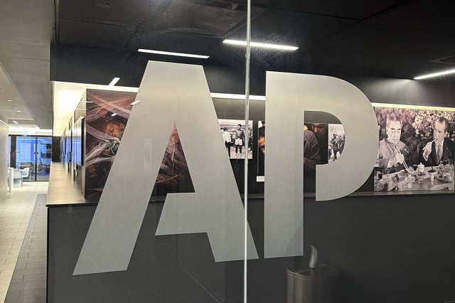 The Associated Press logo is displayed at the news organization's world headquarters in New York on Wednesday, April 9, 2025. (AP Photo/Aaron Jackson)