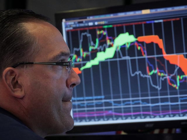 A specialist trader works at his post on the floor at the New York Stock Exchange (NYSE) in New York, U.S., July 16, 2019.