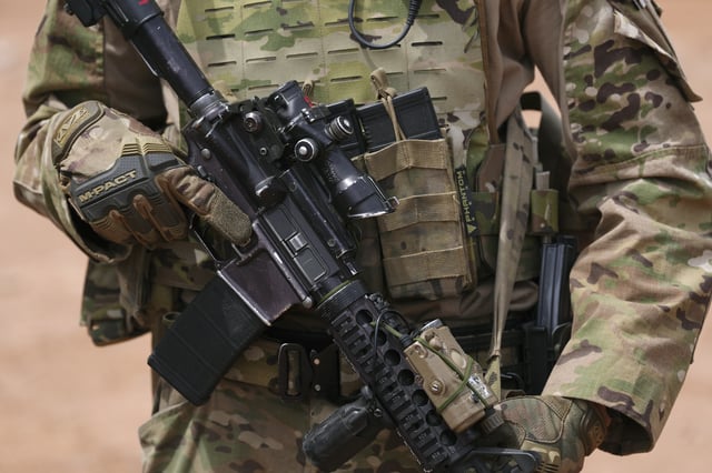 A member of the U.S. Army 212 Infantry 2nd Brigade stands next to the US-Mexico border as part of Joint Task Force Southern Border Thursday, April 3, 2025, in Douglas, Ariz. (AP Photo/Ross D. Franklin)