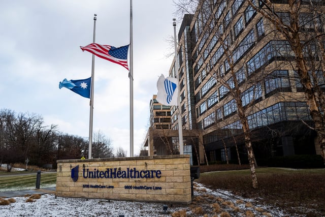 Flags fly at half-mast outside the United Healthcare corporate headquarters on December 4, 2024 in Minnetonka, Minnesota. United Healthcare CEO Brian Thompson was shot dead on the street in New York City before he was to attend the company's annual investors meeting.