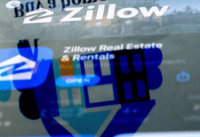 The Zillow website is reflected in the logo of the Zillow app, in Washington, DC, on February 15, 2023.