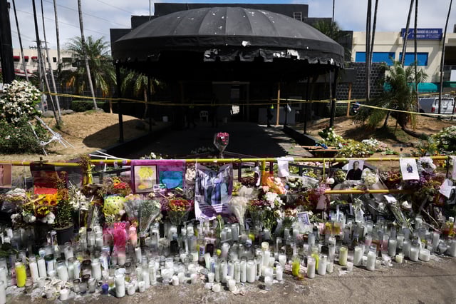 A makeshift memorial stands outside the remains of the Jet Set nightclub after a deadly roof collapse, in Santo Domingo, Dominican Republic April 14, 2025. REUTERS/Ricardo Arduengo