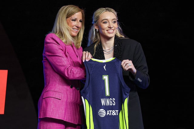 Apr 14, 2025; New York, New York, USA; Paige Bueckers poses with WNBA commissioner Cathy Engelbert after being selected with the number one overall pick to the Dallas Wings in the 2025 WNBA Draft at The Shed at Hudson Yards. Mandatory Credit: Vincent Carchietta-Imagn Images