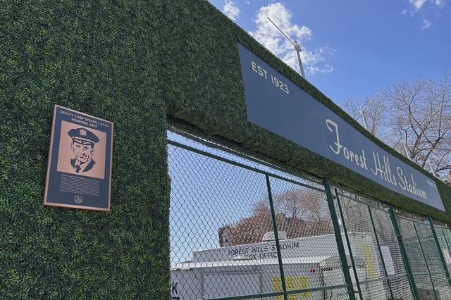 Entrance to Forest Hills Stadium with memorial sign to fallen police officer, Queens, New York.