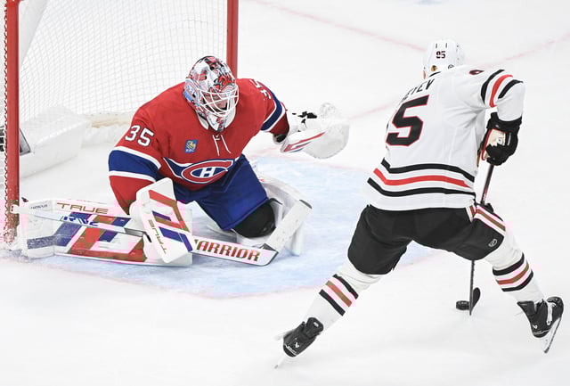 Chicago Blackhawks' Ilya Mikheyev (95) moves in on Montreal Canadiens goaltender Sam Montembeault during second period NHL hockey action in Montreal, Monday, April 14, 2025. 