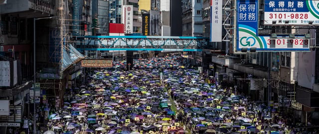 Protesters are seen holding up umbrellas during a march in Hong Kong on September 15, 2019 (Photo by Vernon Yuen/NurPhoto via Getty Images)