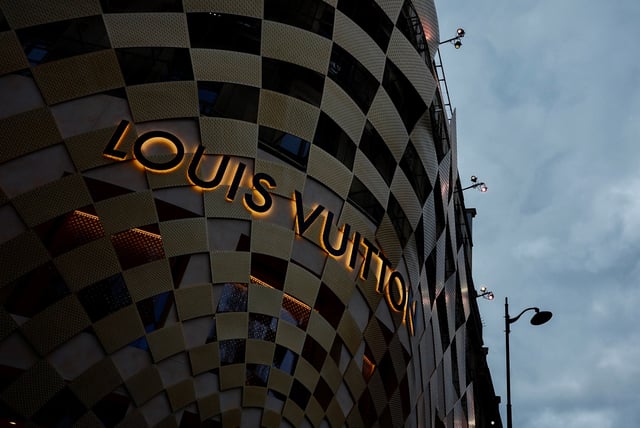 A logo of Louis Vuitton is displayed on a Louis Vuitton store on the Champs-Elysees avenue in Paris, France, March 30, 2024. REUTERS/Gonzalo Fuentes/File Photo