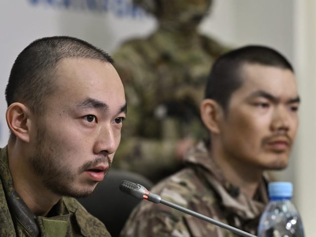 During a press conference on Monday, Zhang and Wang denied fighting against Ukraine voluntarily.