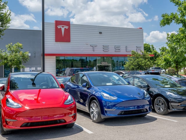 Tesla Model Y SUVs at a Tesla dealership in Austin, Texas.