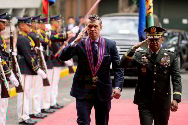 U.S. Defense Secretary Pete Hegseth and Chief of Staff of the Armed Forces of the Philippines Romeo Brawner Jr inspect honor guards during their arrival at Camp Aguinaldo, in Quezon City, Metro Manila, Philippines, March 28, 2025. REUTERS/Lisa Marie David./File Photo