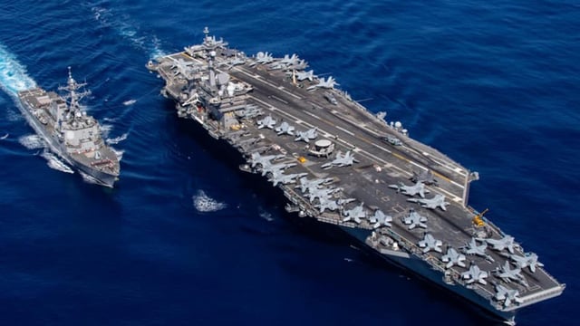 Ahead of the upcoming round of negotiations between the United States and Iran on Tehran's rapidly developing nuclear program, a second US aircraft carrier is in operation in Mideast waters.