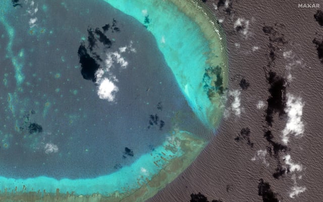 Chinese H-6 bombers fly at the eastern edge of the disputed Scarborough Shoal in the South China Sea, March 24, 2025. Maxar Technologies/Handout via REUTERS/File Photo