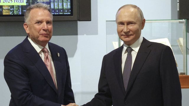 Russian President Vladimir Putin, right, and U.S. President Donald Trump's special envoy Steve Witkoff shake hands prior to their talks in St. Petersburg, Russia, Friday, April 11, 2025. 