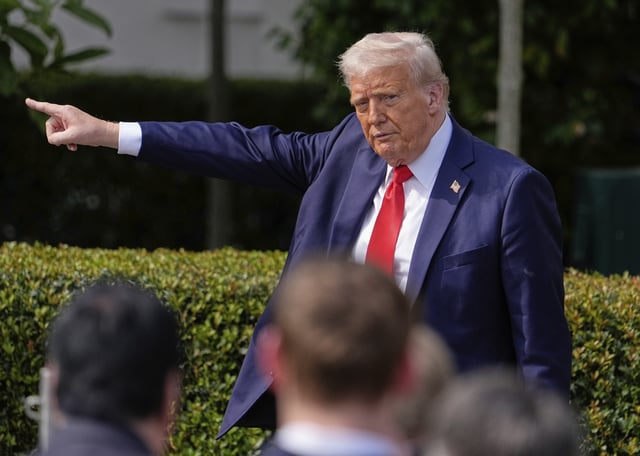 President Donald Trump gestures to the crowd as he departs after welcoming the 2025 College Football National Champions, the Ohio State University football team, during an event on the South Lawn of the White House, Monday, April 14, 2025, in Washington. (AP Photo/Manuel Balce Ceneta)