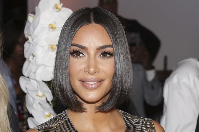 FILE - Kim Kardashian arrives to the Serena Williams fashion show during Fashion Week in New York, Sept. 10, 2019. (AP Photo/Seth Wenig, File)