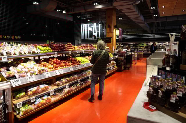 A customer looks for produce at a grocery store in Ottawa, on Wednesday, April 2, 2025. THE CANADIAN PRESS/Justin Tang