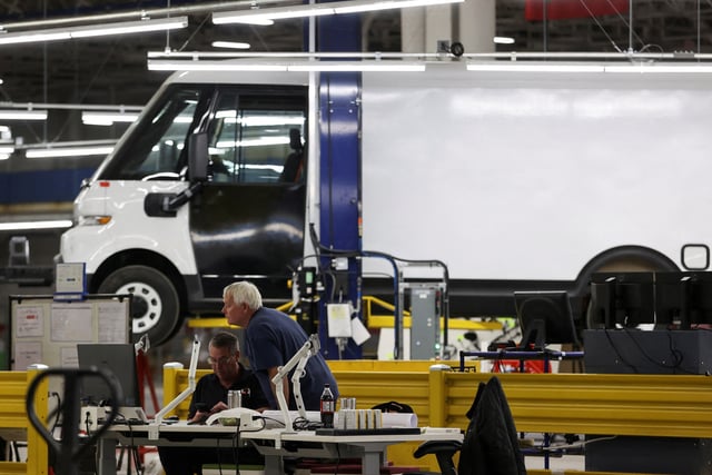 Employees work on the line at automaker General Motors (GM) Brightdrop unit's CAMI EV Assembly, Canada's first full-scale electric vehicle manufacturing plant, in Ingersoll, Ontario, Canada December 5, 2022.  REUTERS/Carlos Osorio/File Photo