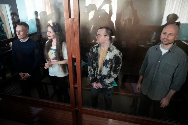 Four Russian journalists, shown at a court in Moscow, Russia, on October 2, have been sentenced to five years and six months in prison, after they were accused of working for a banned organization linked to Alexey Navalny.