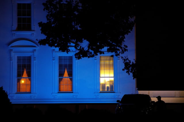 The North Portico of the White House is illuminated in blue for Autism Awareness Day, in Washington, U.S. April 2, 2020. REUTERS/Tom Brenner/File Photo