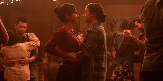 Bella Ramsey as Ellie dancing with Isabela Merced as Dina slow dancing in The Last of Us Season 2.