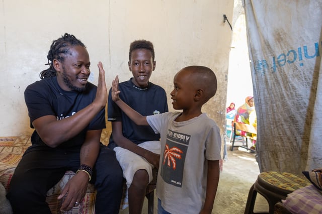 Ishmael Beah meets with Sudanese children.