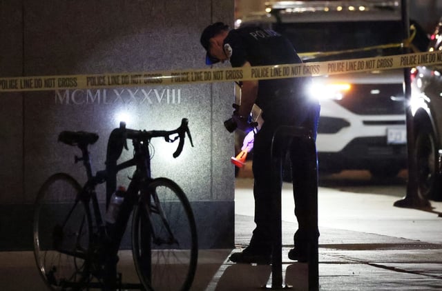 A Chicago Police evidence technician processes a scene in the 400 block of North City Front Plaza Drive where a 15-year-old boy was shot on March 28, 2025. (Terrence Antonio James/Chicago Tribune)