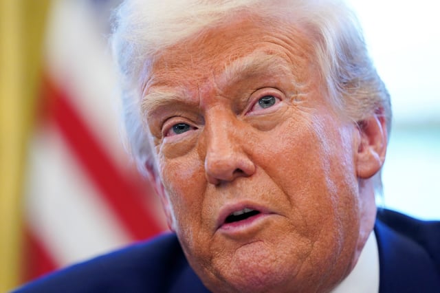 U.S. President Donald Trump speaks, as he signs executive orders and proclamations in the Oval Office at the White House in Washington, D.C., U.S., April 9, 2025. REUTERS/Nathan Howard/File Photo