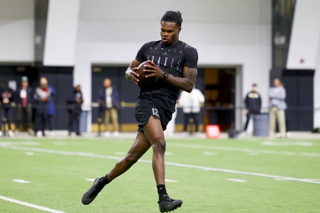 Apr 4, 2025; Boulder, CO, USA; Colorado Buffaloes wide receiver Travis Hunter (12) catches a pass at the University of Colorado NFL Showcase at the CU Indoor Practice Facility. Mandatory Credit: Michael Ciaglo-Imagn Images/File photo