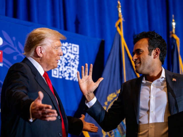 ATKINSON, NEW HAMPSHIRE - JANUARY 16: Republican presidential candidate, former U.S. President Donald Trump greets U.S. entrepreneur Vivek Ramaswamy while speaking during a campaign rally at the Atkinson Country Club on January 16, 2024 in Atkinson, New Hampshire. Trump won this week's Iowa caucus, solidifying him as the lead Republican nominee in the first balloting of 2024. The former U.S. President heads to Atkinson, New Hampshire today as he continues campaigning during the primary election.