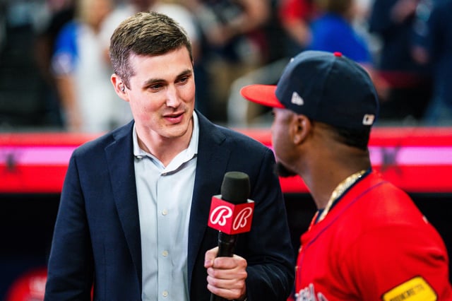 Reporter Wiley Ballard interviews Ozzie Albies of the Atlanta Braves on April 26, 2024.