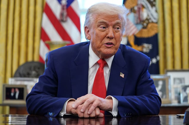 U.S. President Donald Trump speaks, as he signs executive orders and proclamations in the Oval Office at the White House in Washington, D.C., U.S., April 9, 2025. REUTERS/Nathan Howard/File Photo