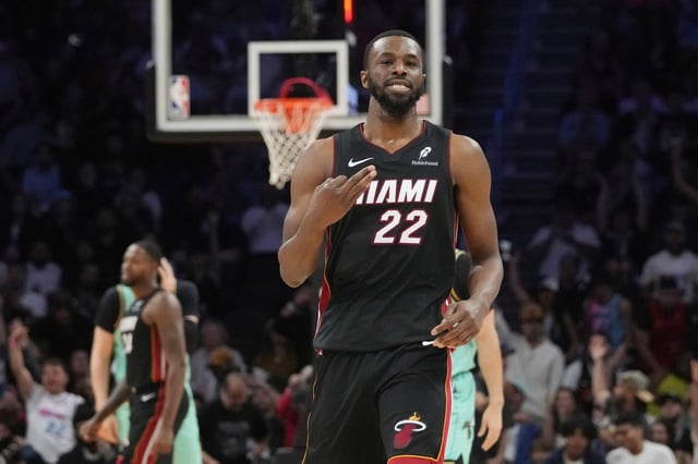 Miami Heat forward Andrew Wiggins (22) gestures after scoring a 3-pointer during the second half of an NBA basketball game against the Charlotte Hornets, Sunday, March 23, 2025, in Miami. (AP Photo/Marta Lavandier)