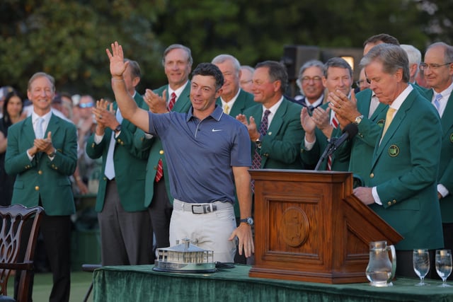 Golf - The Masters - Augusta National Golf Club, Augusta, Georgia, U.S. - April 13, 2025 Northern Ireland's Rory McIlroy takes the applause of Augusta National members during the green jacket presentation after winning The Masters and completing a career grand slam REUTERS/Mike Blake
