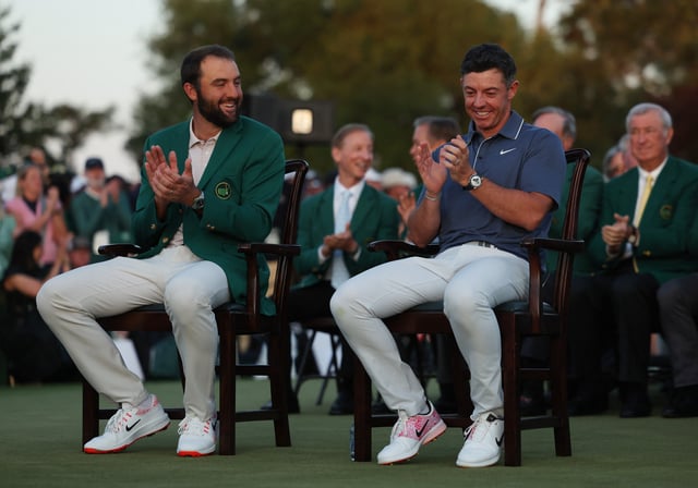 Golf - The Masters - Augusta National Golf Club, Augusta, Georgia, U.S. - April 13, 2025 Northern Ireland's Rory McIlroy before being presented with the green jacket by Scottie Scheffler of the U.S. after winning The Masters and completing a career grand slam REUTERS/Pilar Olivares