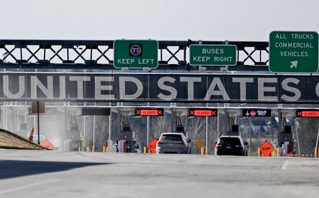 Vehicles approach the United States border crossing as seen from Saint-Bernard-de-Lacolle, Que., on April 10, 2025. 