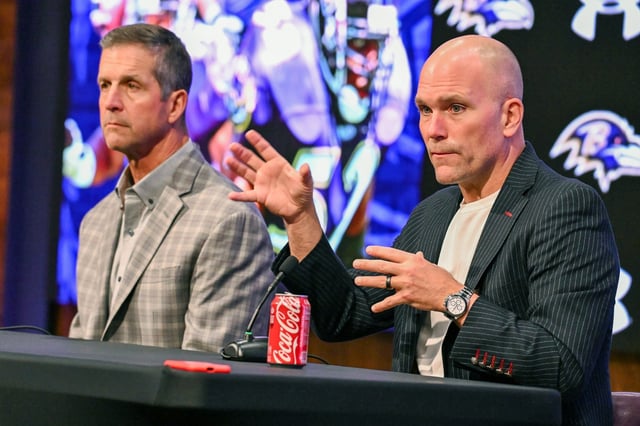 Ravens head coach John Harbaugh, left, and General Manager, Eric DeCosta, talks with the media during the pre-draft luncheon at the Owings Mills facility. (Kevin Richardson/Staff)