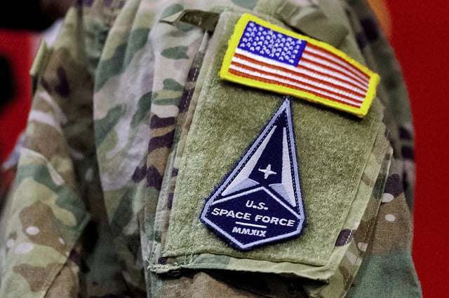 FILE - A solider wears a U.S. Space Force uniform during a ceremony for U.S. Air Force airmen transitioning to U.S. Space Force guardian designations at Travis Air Force Base, Calif., Feb. 12, 2021. (AP Photo/Noah Berger, File)