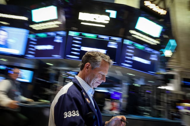 A trader works on the floor at the New York Stock Exchange (NYSE) in New York City, U.S., April 15, 2025.  REUTERS/Brendan McDermid