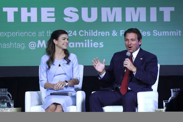 Florida First Lady Casey DeSantis listens to Governor Ron DeSantis during a panel discussion at the 2024 Florida Children and Families Summit at the JW Marriott Grand Lakes in Orlando, Wednesday, Sept. 4, 2024. The event hosted by the Florida Department of Children and Families has met annually since 1997 and runs through Friday.  (Joe Burbank/Orlando Sentinel)
