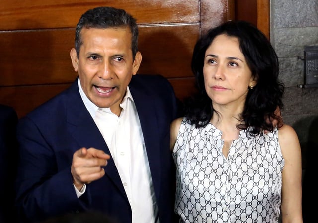 Peru's former President Ollanta Humala speaks next to his wife Nadine Heredia outside their home after being released from preventative detention awaiting trial on charges of money laundering, in Lima on April 30, 2018.