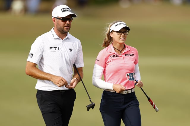 Corey Conners of Canada and Brooke M. Henderson of Canada walk on the 18th hole during the first round of the Grant Thornton Invitational at Tiburon Golf Club on December 08, 2023 in Naples, Florida.