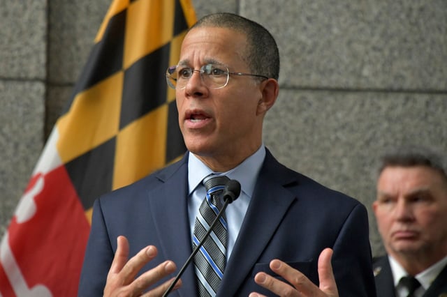 Attorney General Anthony Brown, joined by Police Commissioner Richard Worley, right, Mayor Brandon Scott, and other law enforcement officials, announces the indictment of four adults and two juveniles on multiple criminal counts. Over a span of 13 months, the criminal gang is charged with committing first degree murder, armed carjackings, armed robbery, assault, burglary and firearm-related charges. The investigation revealed at least 35 carjackings, eight attempted carjackings, and at least two attempted murders.