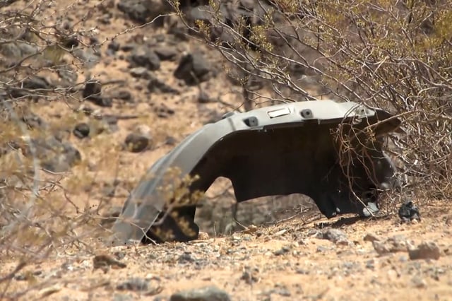What appears to be a piece of a vehicle at the scene of a police investigation where a military vehicle accident occurred near the Santa Teresa Border Patrol station in New Mexico, on Tuesday.