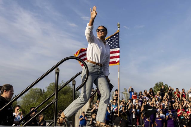 Rep. Alexandria Ocasio-Cortez waves to the crowd during a rally at Folsom lake College in Folsom on April 15, 2025.