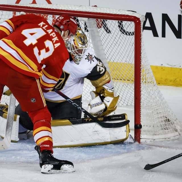 Vegas Golden Knights' goalie Ilya Samsonov (35) looks for the puck as Calgary Flames' Adam Klapka (43) hits the post during second period NHL hockey action in Calgary on Tuesday, April 15, 2025. THE CANADIAN PRESS/Jeff McIntosh