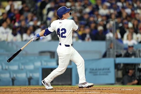 LOS ANGELES, CALIFORNIA – APRIL 15: Will Smith #16 of the Los Angeles Dodgers hits a three-run home run against the Colorado Rockies during the third inning at Dodger Stadium on April 15, 2025 in Los Angeles, California. All players are wearing the number 42 in honor of Jackie Robinson Day.  (Photo by Luke Hales/Getty Images)